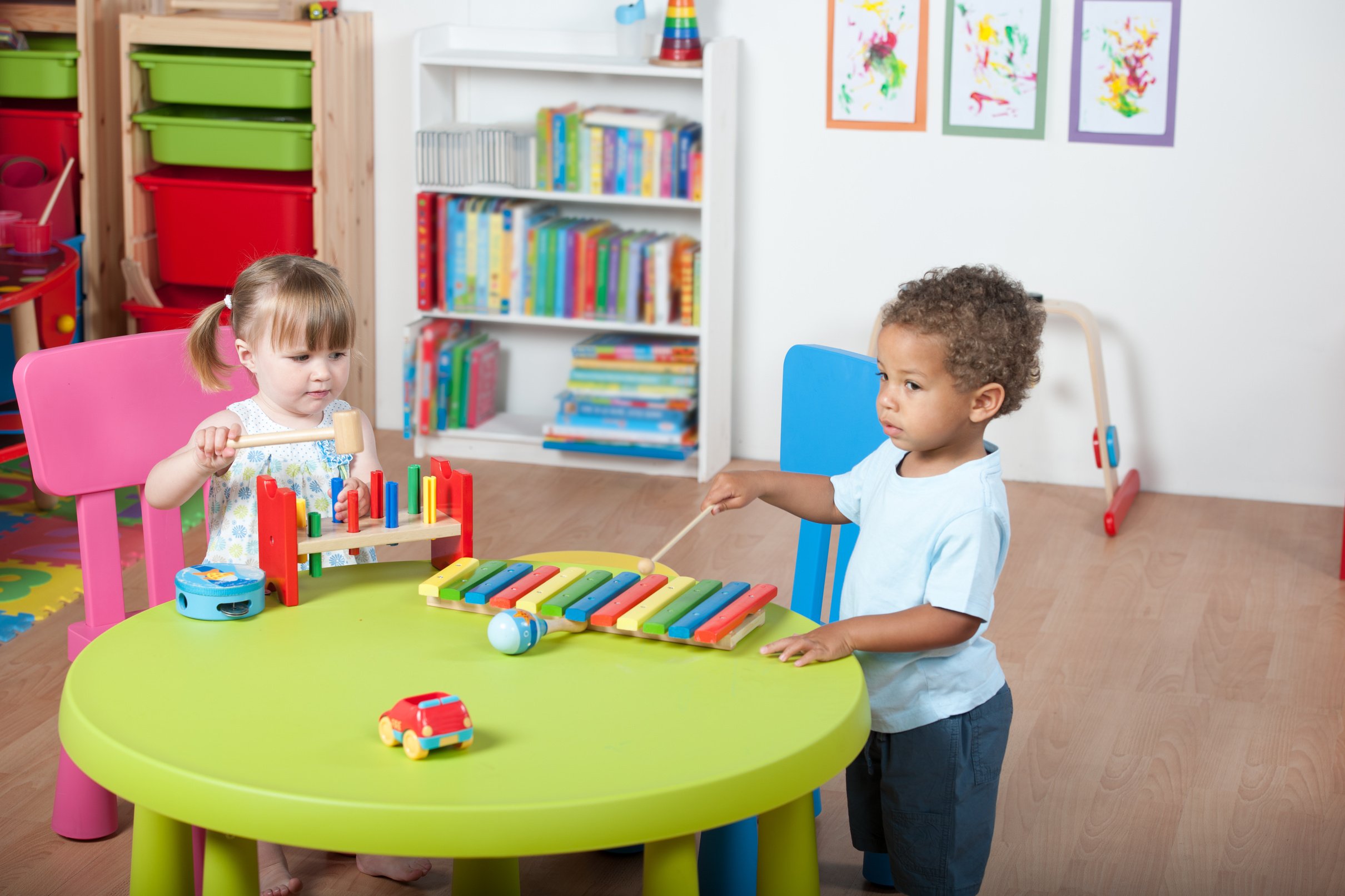 Toddlers Enjoying Music/ Playtime In A Nursery